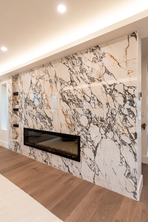 Fireplace wall in Cambridge, MA by First Class Marble & Granite